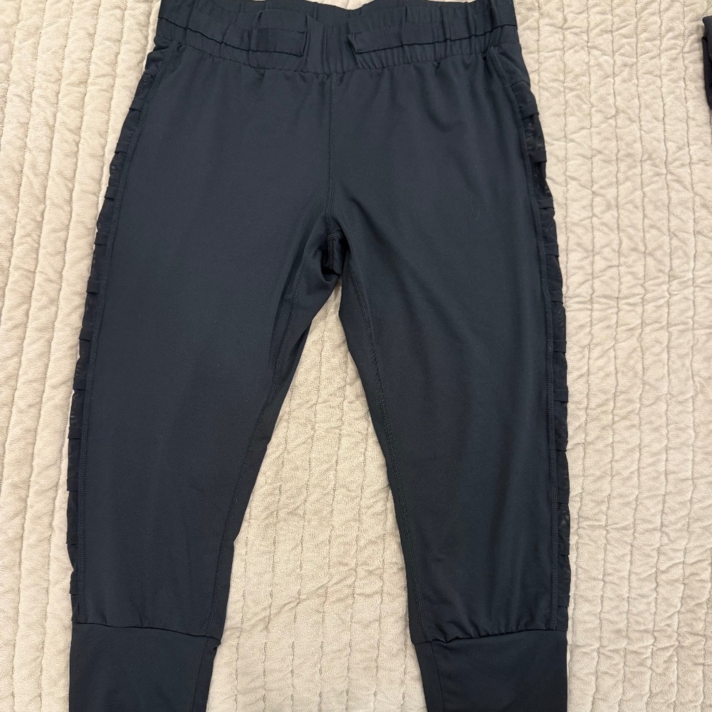 Fabletics black cropped leggings with sheer detailing on the sides size XS